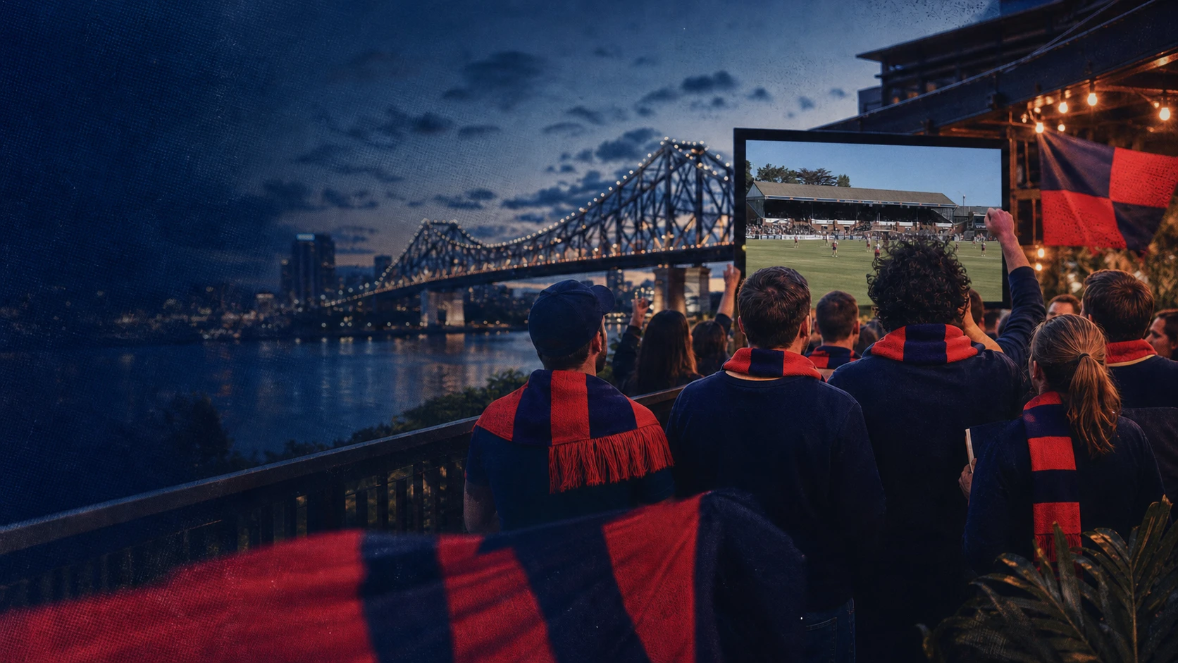 Brisbane football supporters in red and blue watching a match beside the Story Bridge